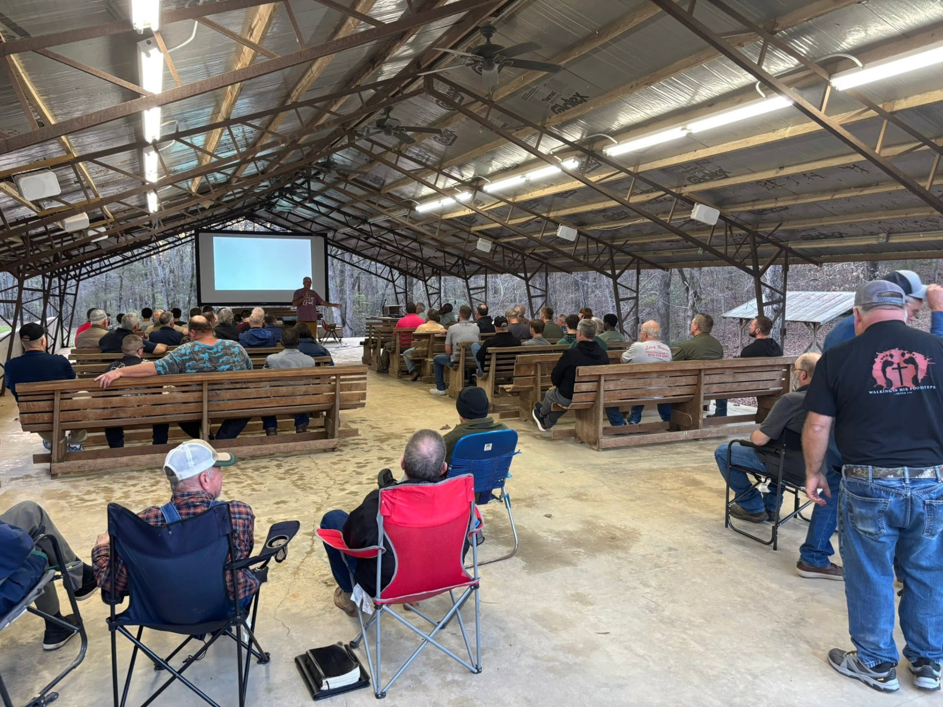 The pavilion full of men listening to a lesson at the 2026 retreat